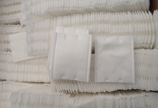 Square cotton pad folding machine
