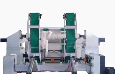 Jumbo roll slitting and rewinding machine